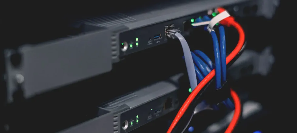 Managed Network Infrastructure Enterprise network switch installed in a server rack representing professionally managed business network infrastructure.